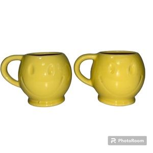 Smiley Face‎ mugs. Sold as a pair. Bright yellow with eyes and smile impression.